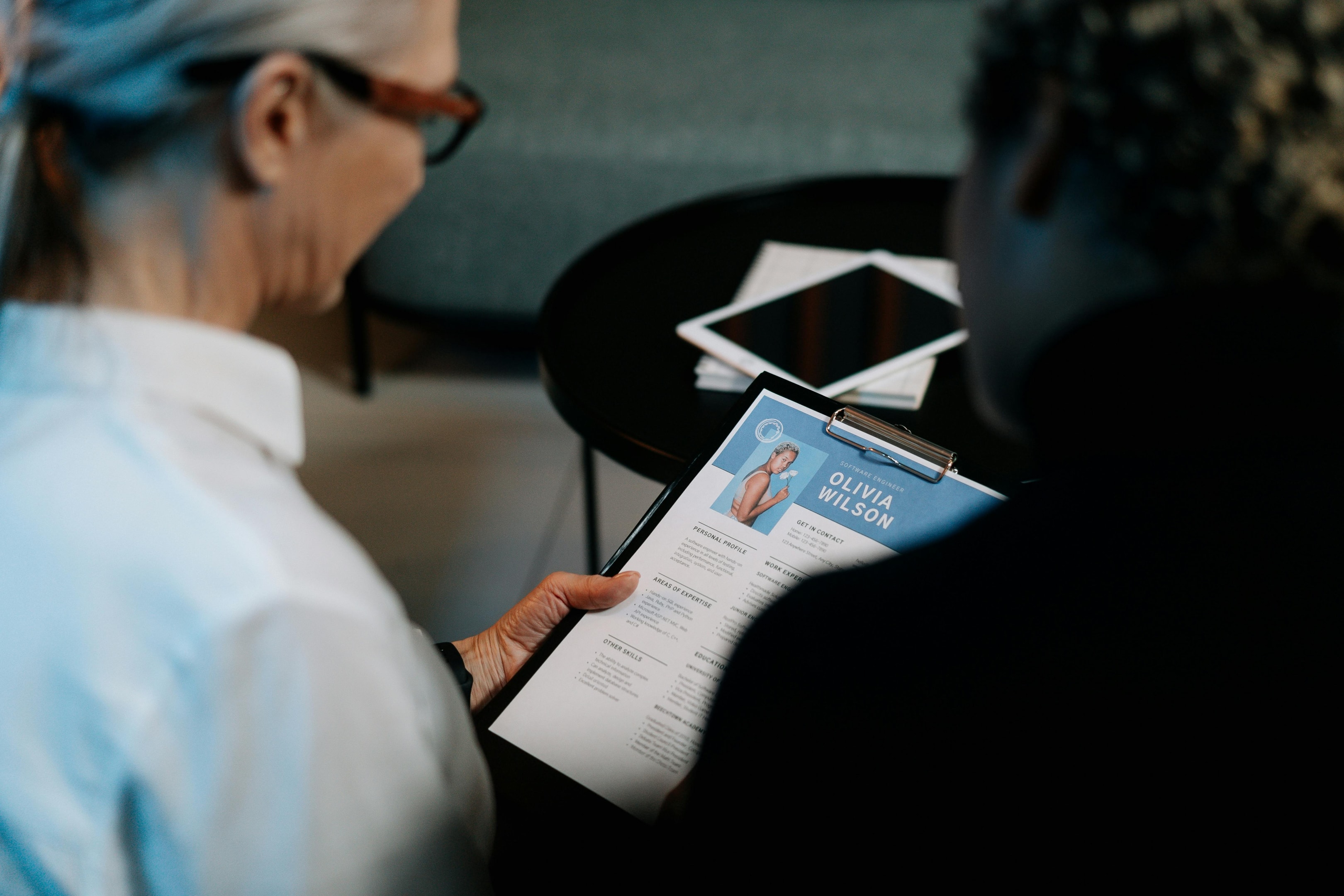 Recruiters manually review a CV — a time-consuming step that can be automated with Simply.