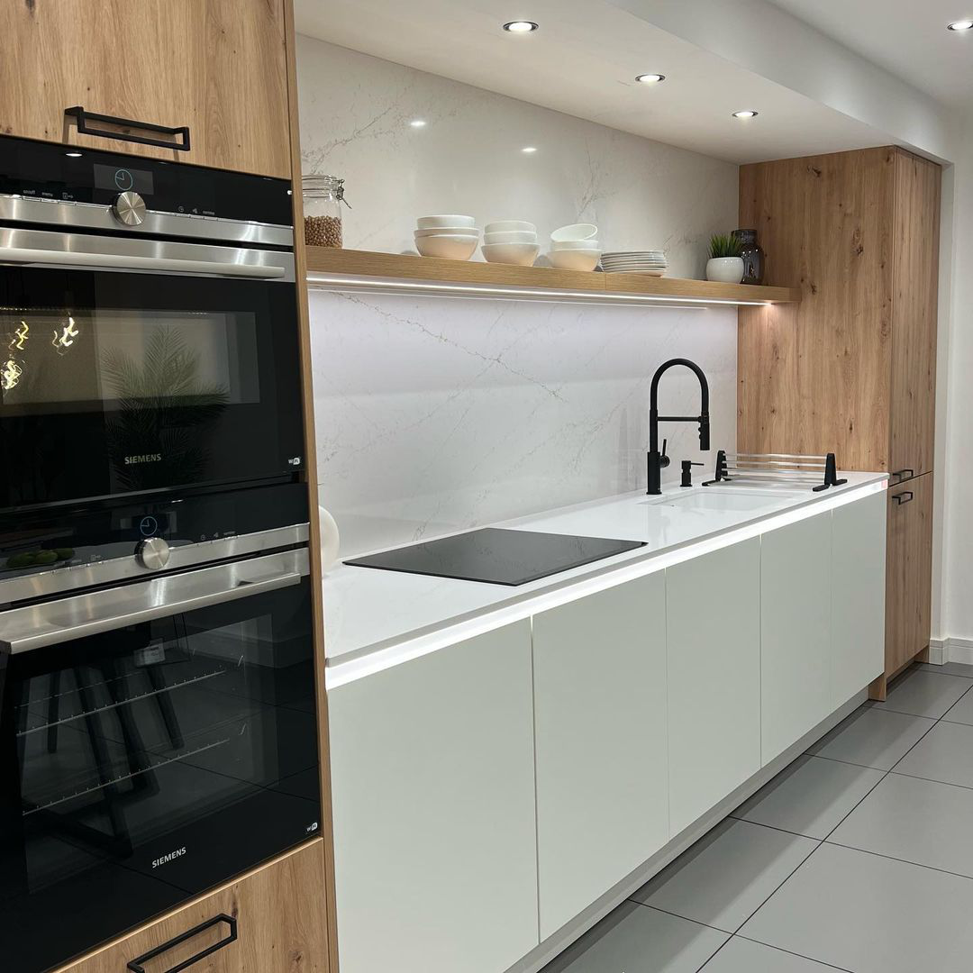 Unique kitchen backsplashes with marble and matt black ironmongery