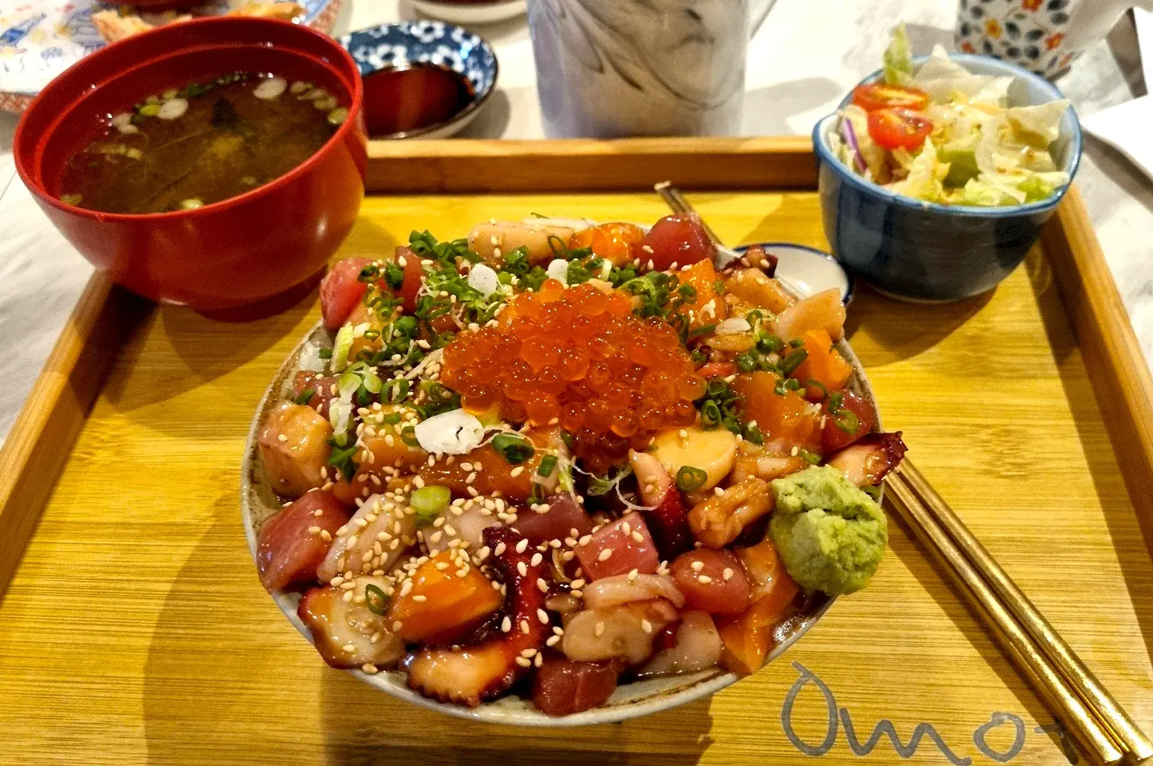 The signature Omote Chirashi at Omote, Thomson Plaza, known for its overflowing pile of diced sashimi, salmon roe, and savory seasoning.