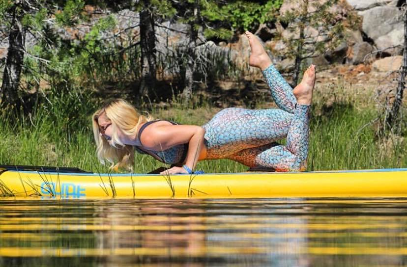 sup yoga on a stand up paddle board
