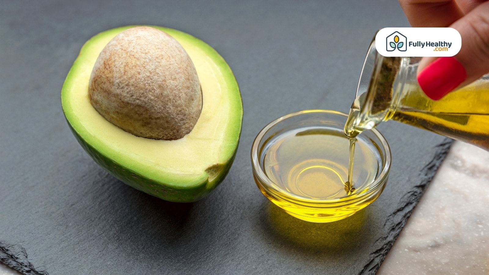Fresh avocado with small bowl of oil being poured in