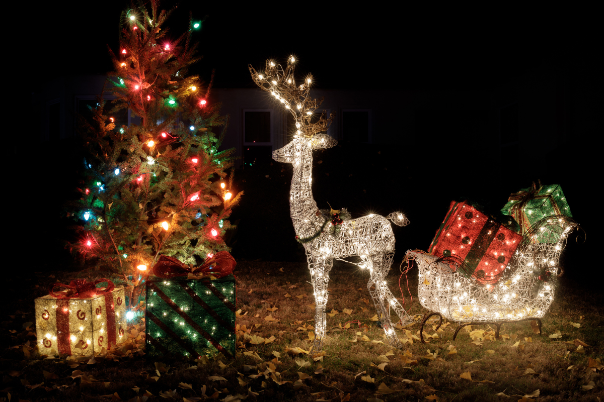 An outdoor holiday scene with farmhouse Christmas decorations and a cozy feel.