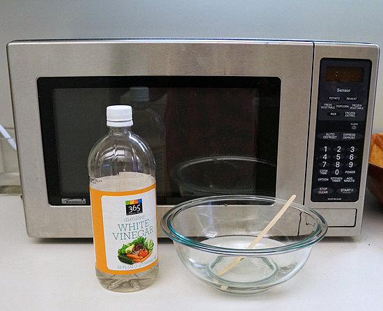 Clean microwave with vinegar and water