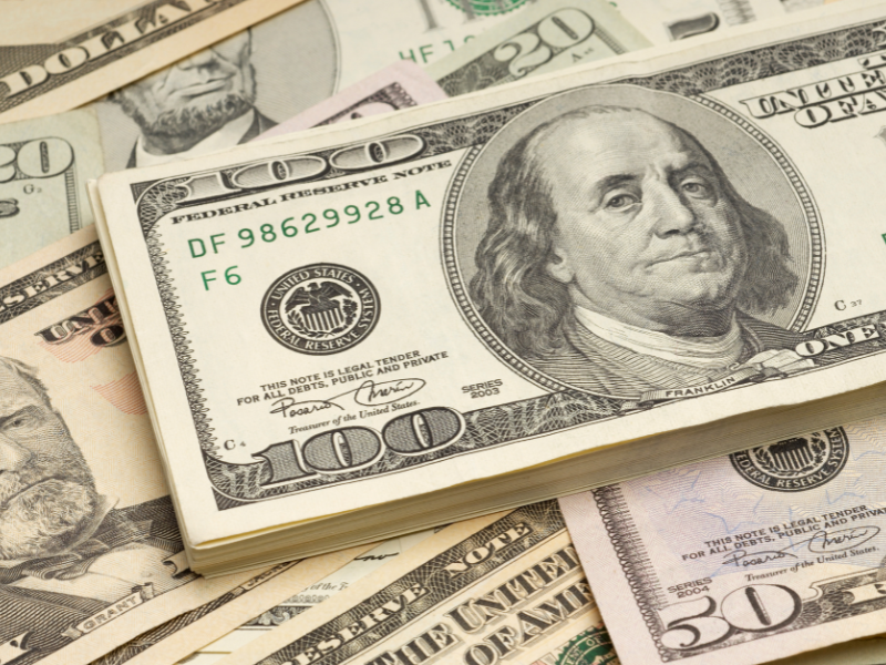 Image of cash representing car accident settlements.