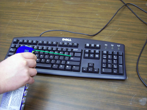 Use compressed air to remove dirt from the computer or laptop keyboard