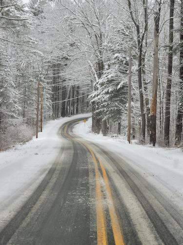 Driving along a winter road in Massachusetts