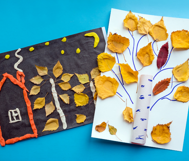Thanksgiving crafts, construction paper and paper towel roll fall trees with leaves. 