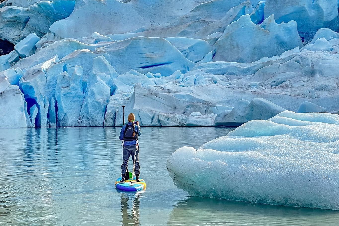 stand up paddleboard surrounded by ice