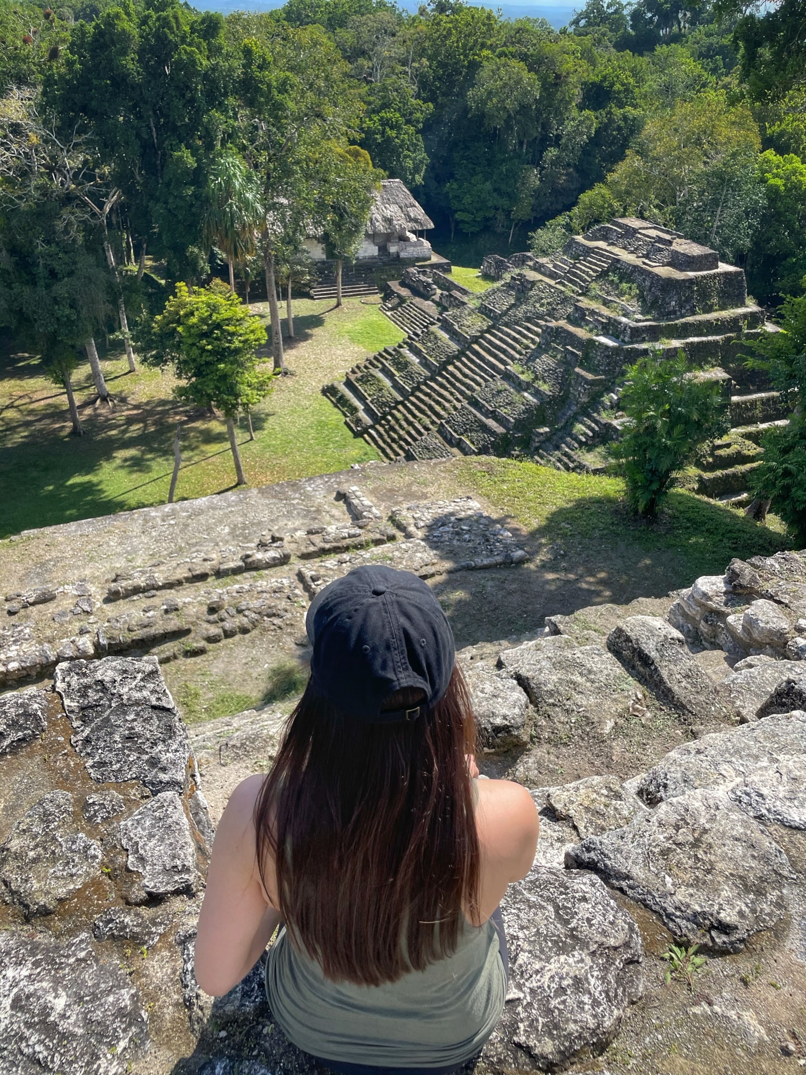Sitting on top of a temple in Yaxha