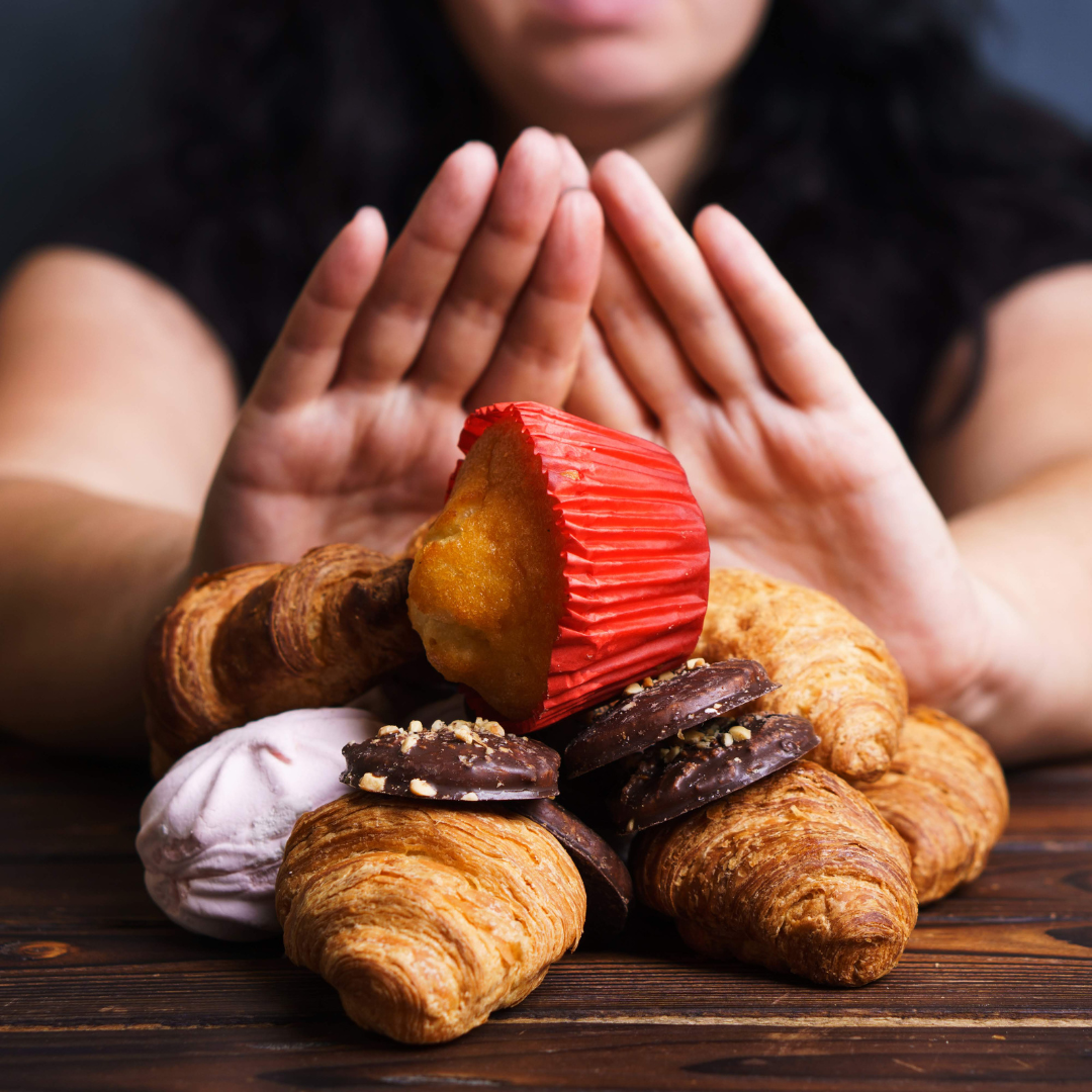 woman pushing away junk food