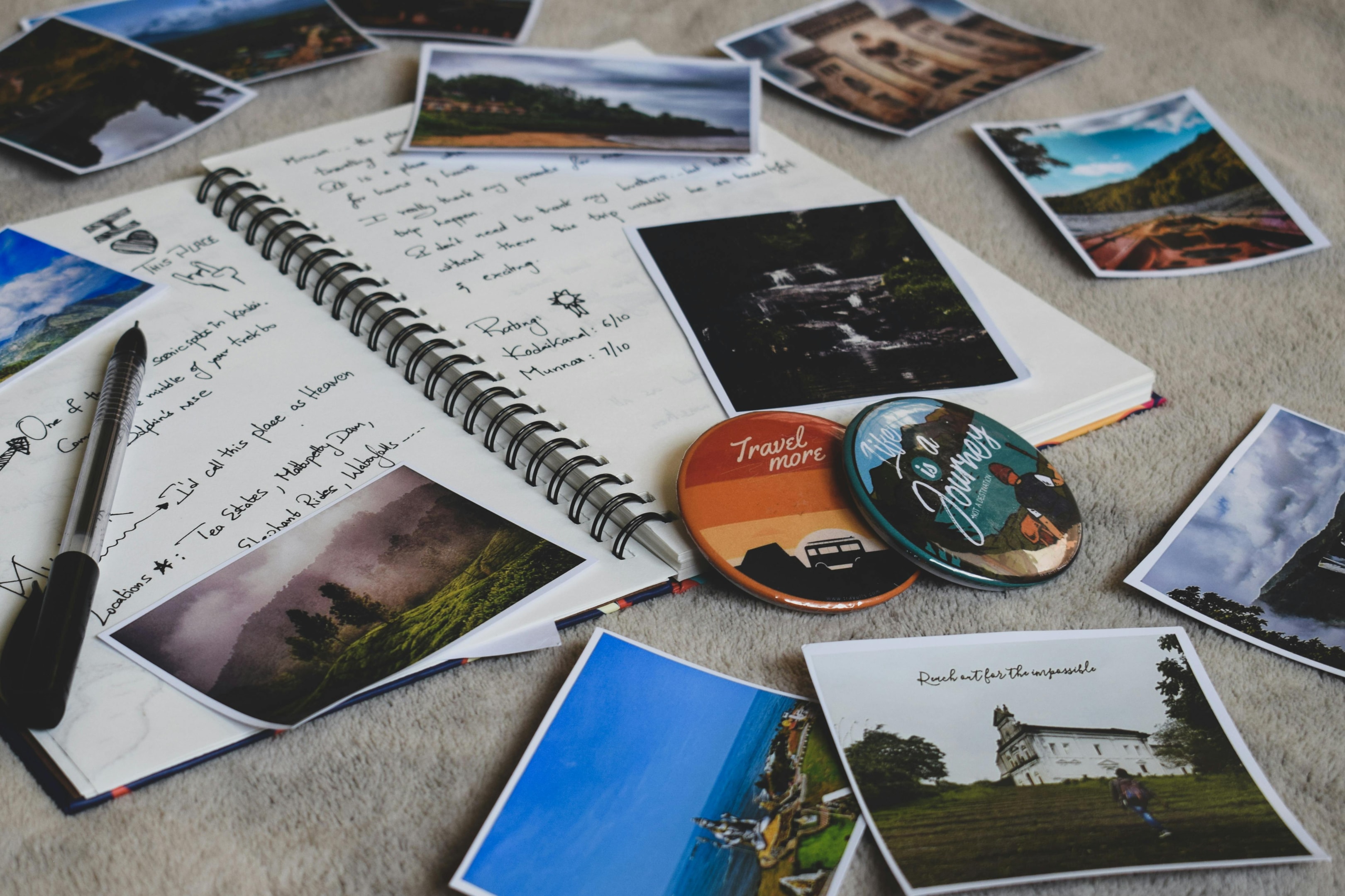 Journal laying open with unattached photos on top