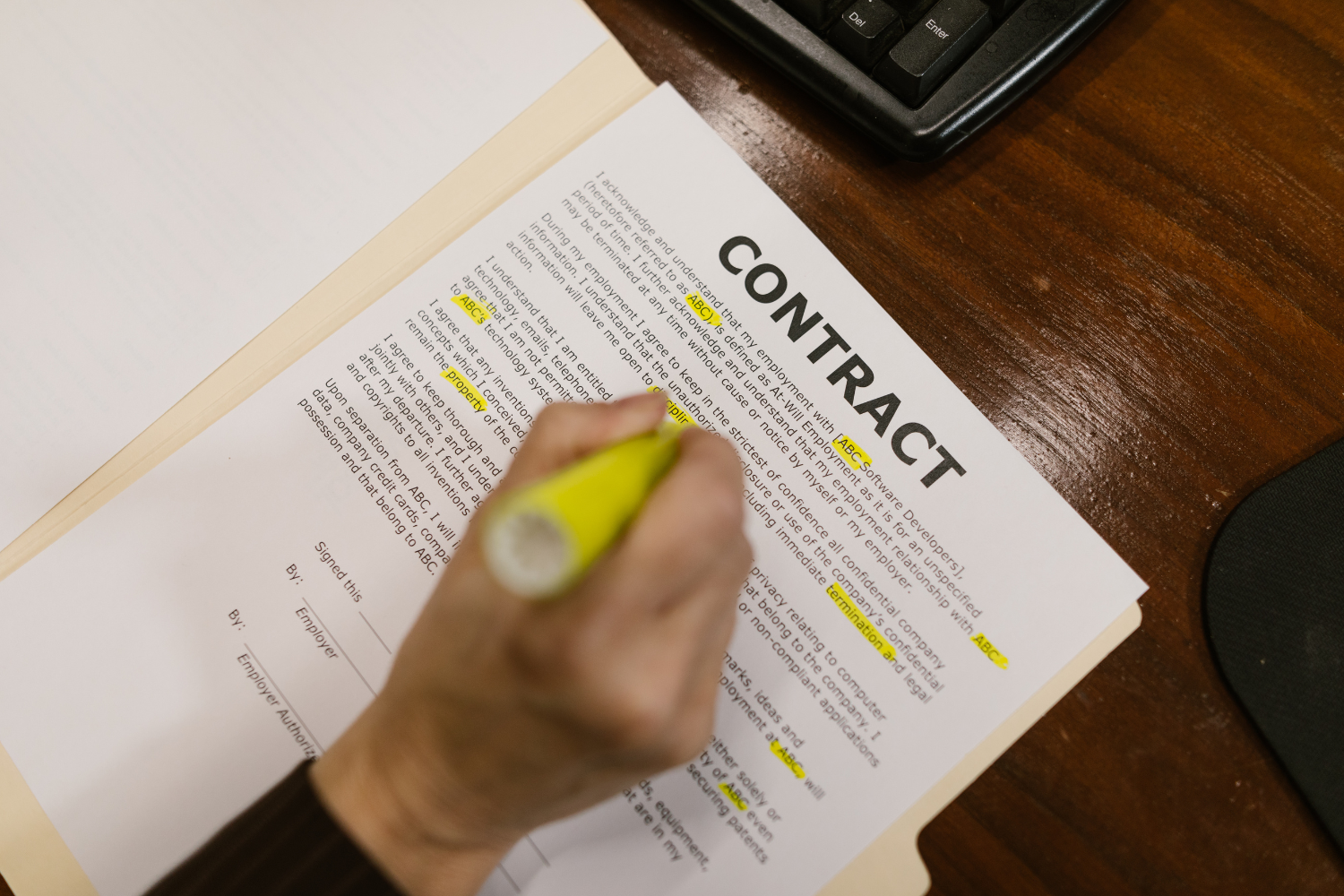 Businessperson reviewing a draft broker contract before signing.