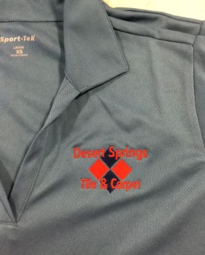 Desert Springs Tile & Carpet's company logo looks amazing on gray embroidered polo shirts