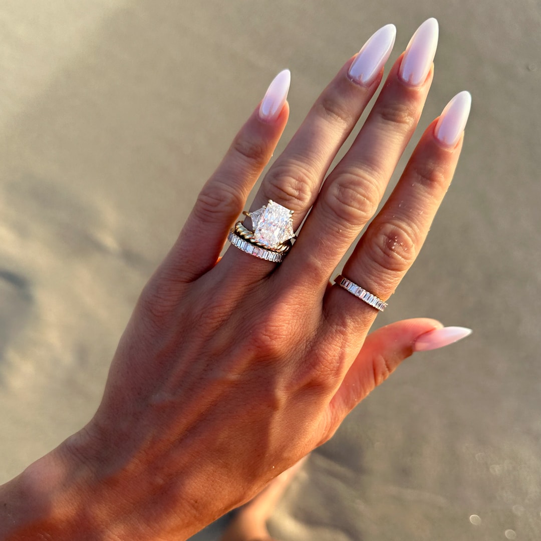 Three Stone Engagement Ring with Shield Side Stones and an Elongated Radiant cut Diamond