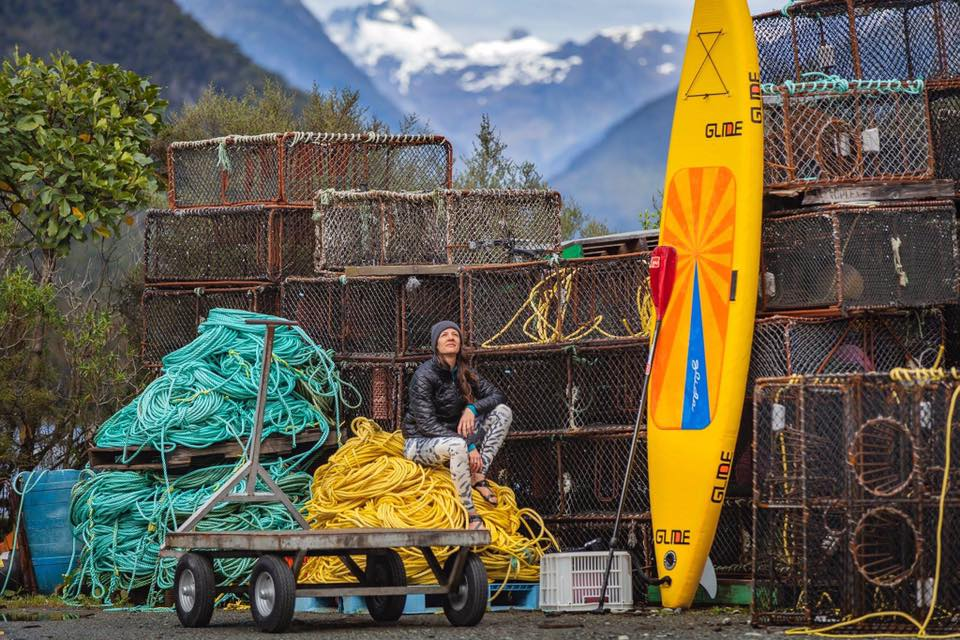 woman with inflatable paddle board