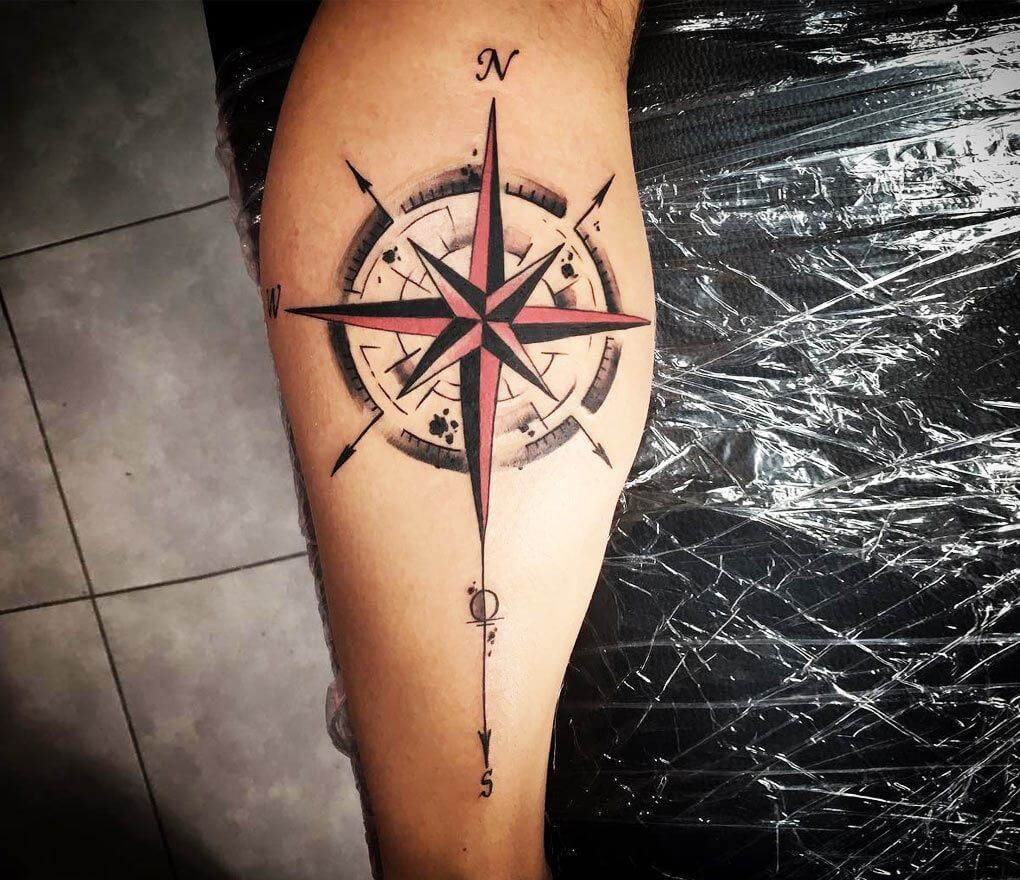 Source: https://www.worldtattoogallery.com/photo/100026324/compass-tattoo-by-kafka-tattoo    Caption: Compass on forearmon man's lower arm