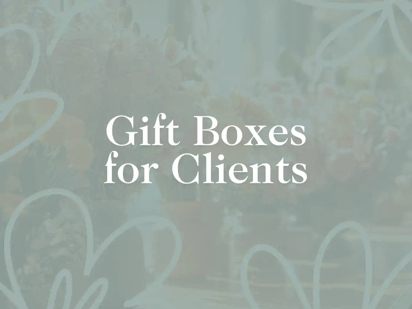 Promotional image featuring the text 'Gift Boxes for Clients' overlaying a subtle floral background, designed to evoke elegance and care in client relations. Fabulous Flowers and Gifts - Delivered with Heart.