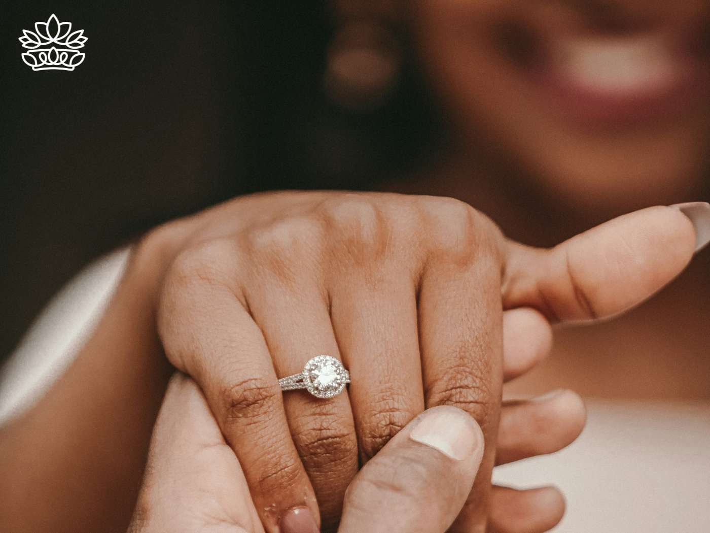 Close-up of an elegant engagement ring being placed on a finger, symbolizing a promise of love. This intimate moment reflects one of the best engagement gift ideas for foodie couples, a treasure among the engagement gifts from the Fabulous Flowers and Gifts Engagement Collection.