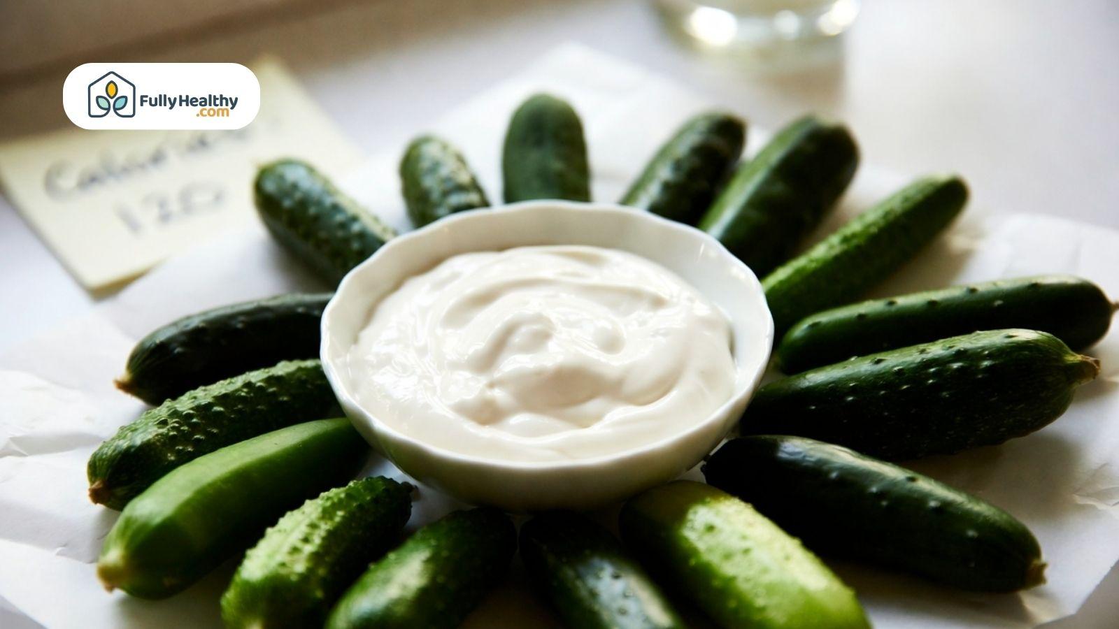 Mini cucumbers served with creamy dip in a bowl for snacking.
