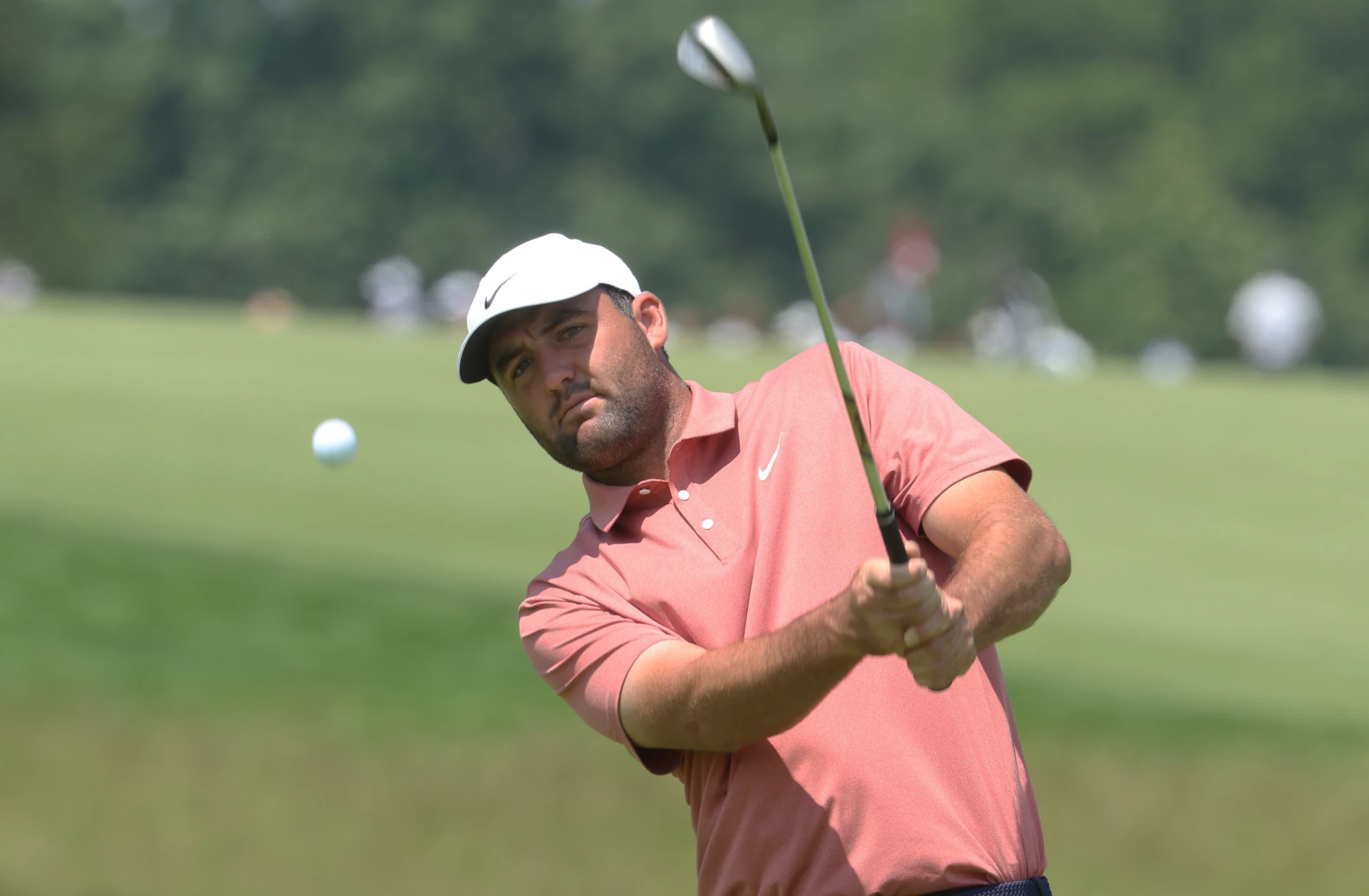 Jun 11, 2025; Oakmont, Pennsylvania, USA; Scottie Scheffler chips on the tenth fairway during a practice round for the U.S. Open golf tournament at Oakmont Country Club.