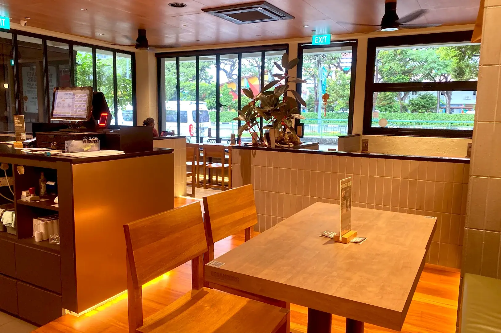 Modern, cozy interior of VeganBurg, a plant-based, halal-certified fast-food restaurant offering sustainable burger dining in a welcoming environment.
