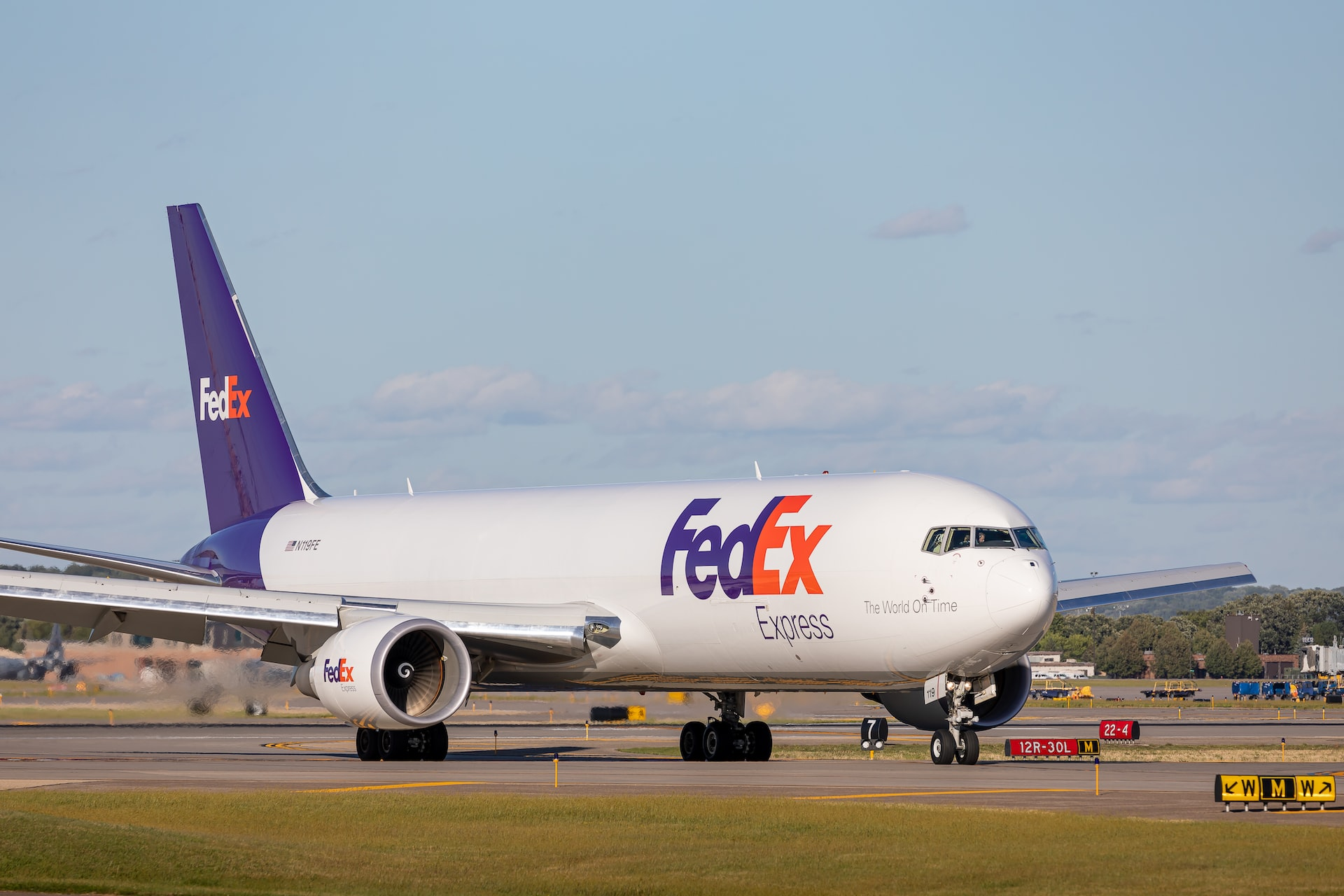 A type of airplanes: A FedEx cargo plane taxiing to the runway.