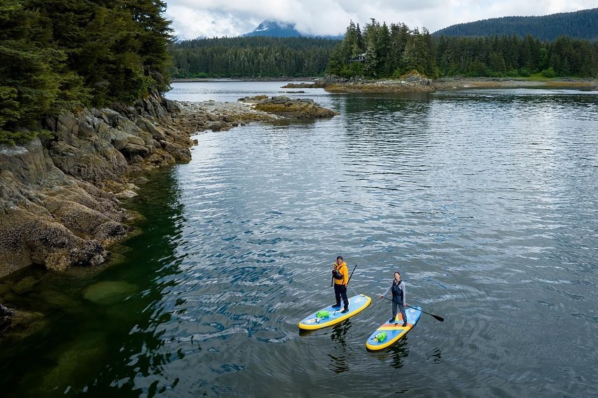 two people on inflatable paddle boards