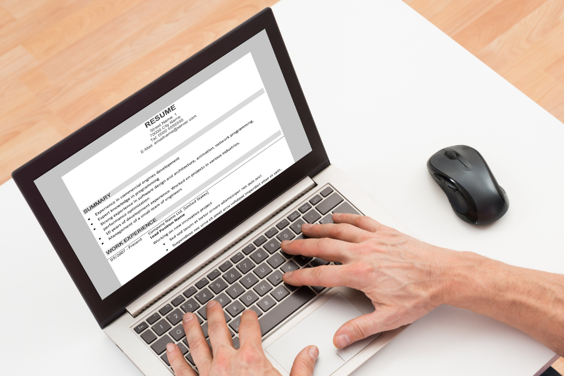 HR reviewing a candidate’s resume on a laptop screen