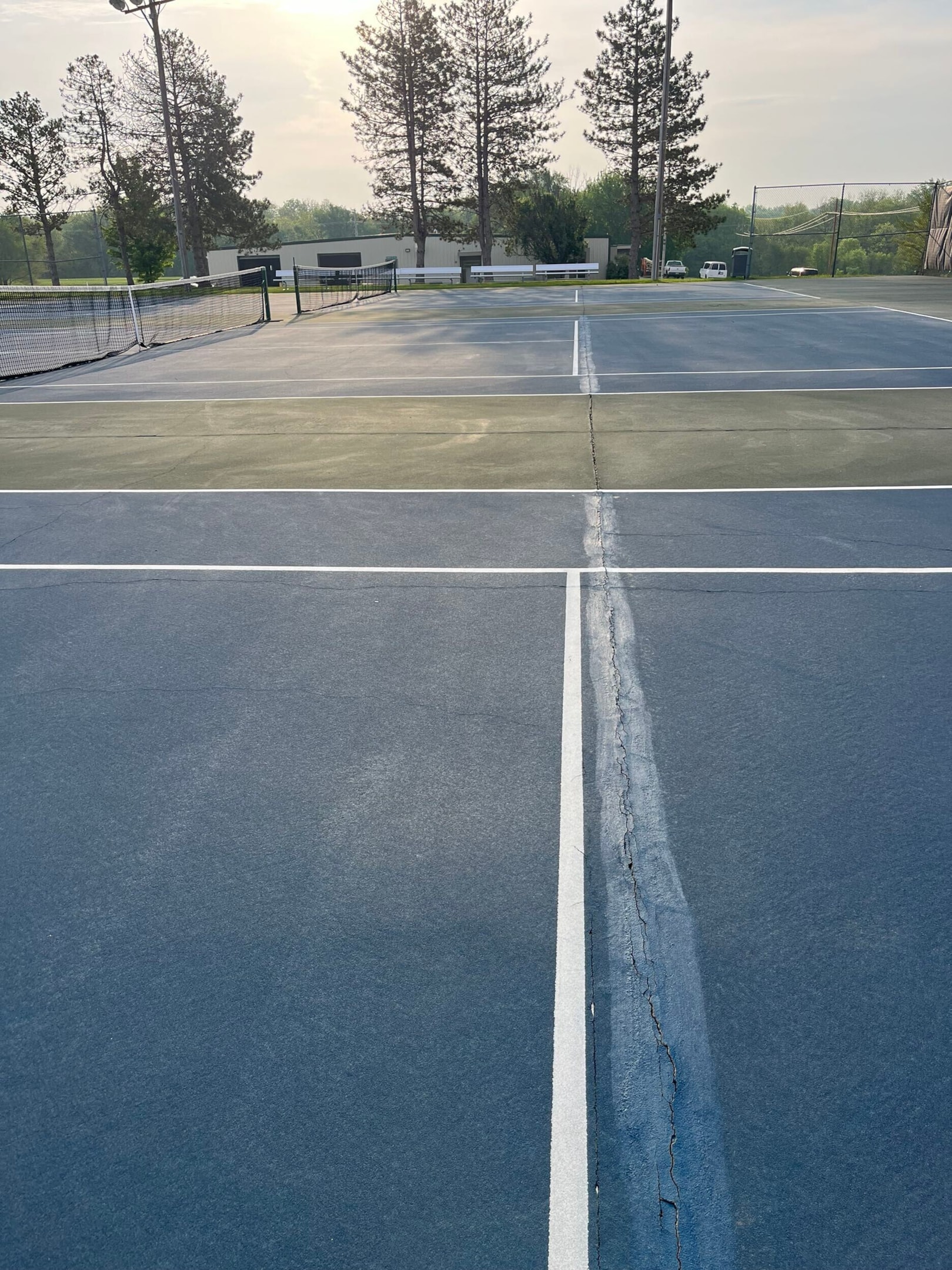 Worn our tennis court with visible cracks