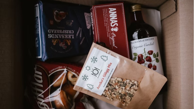 A box showing care package with edible items 