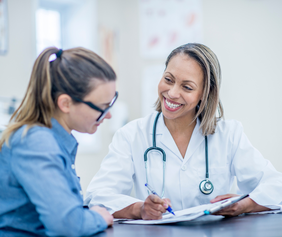 A doctor and a patient discussing a treatment plan in a rehab center