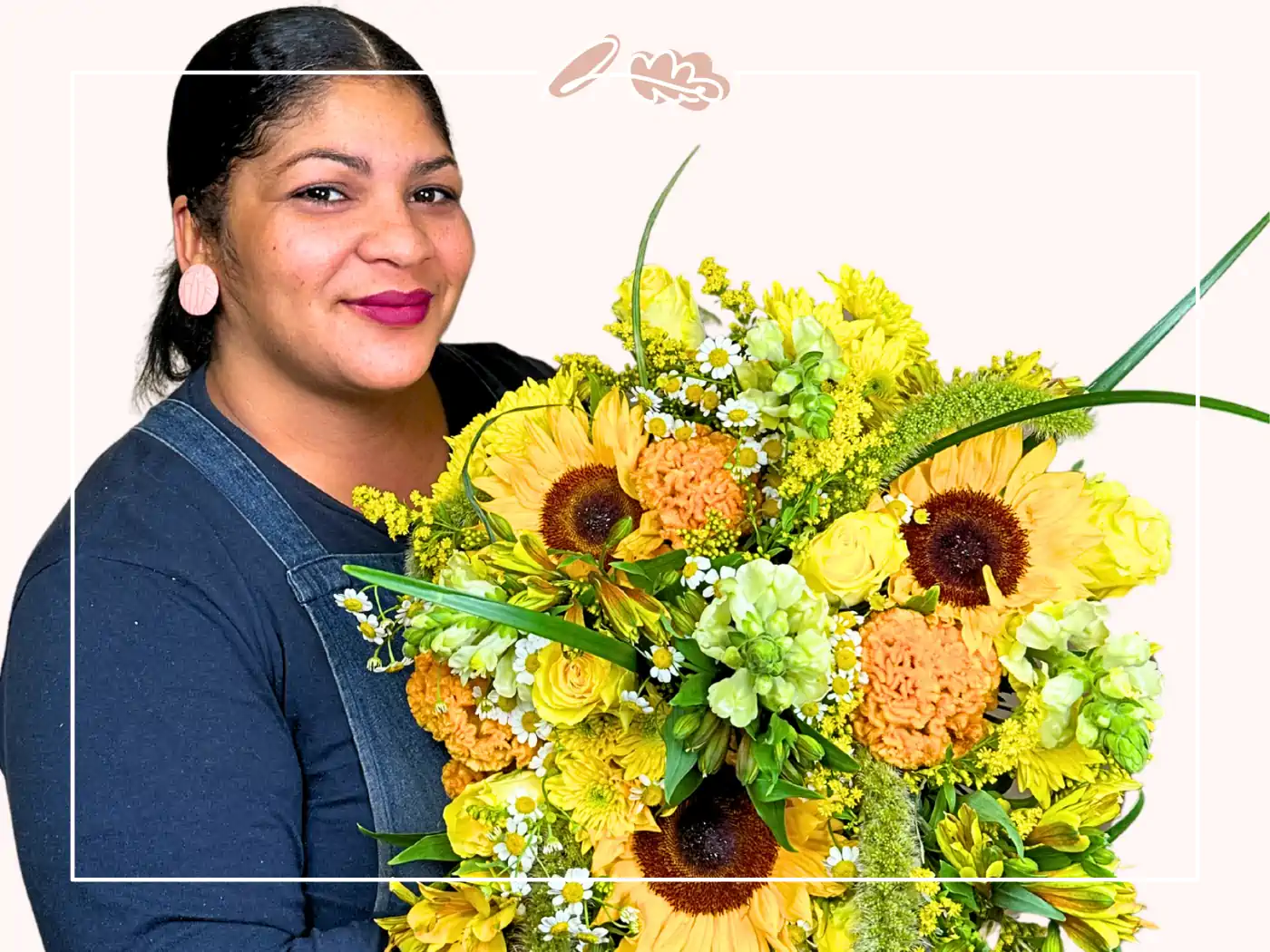 A smiling woman holding a bright bouquet of sunflowers and yellow blooms. Fabulous Flowers and Gifts.