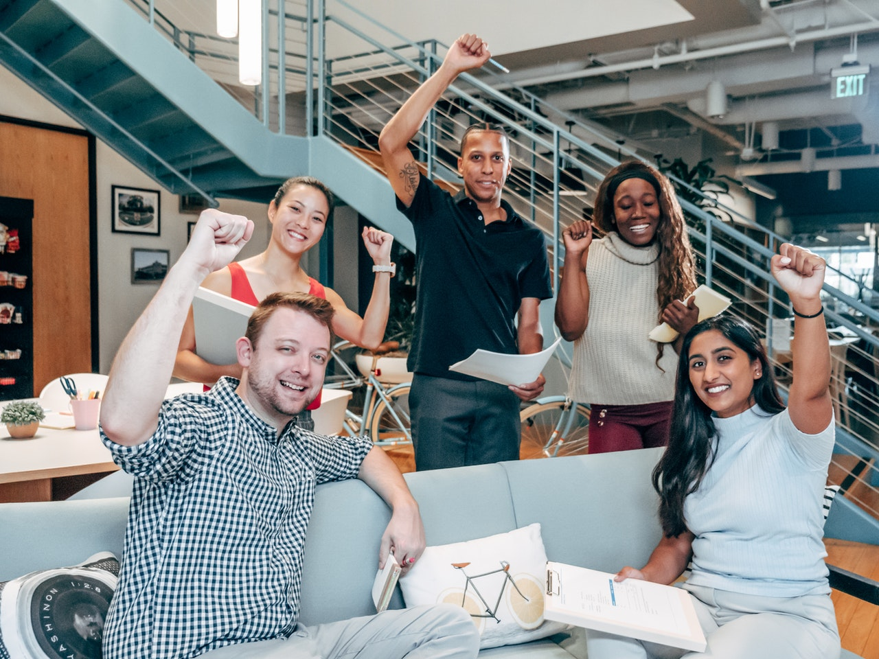 People cheering in translation companies because of quality translation services 