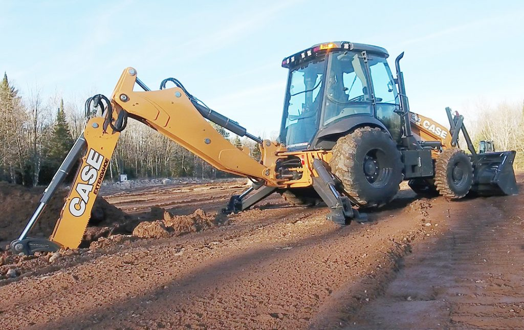 CASE backhoe loader in a field