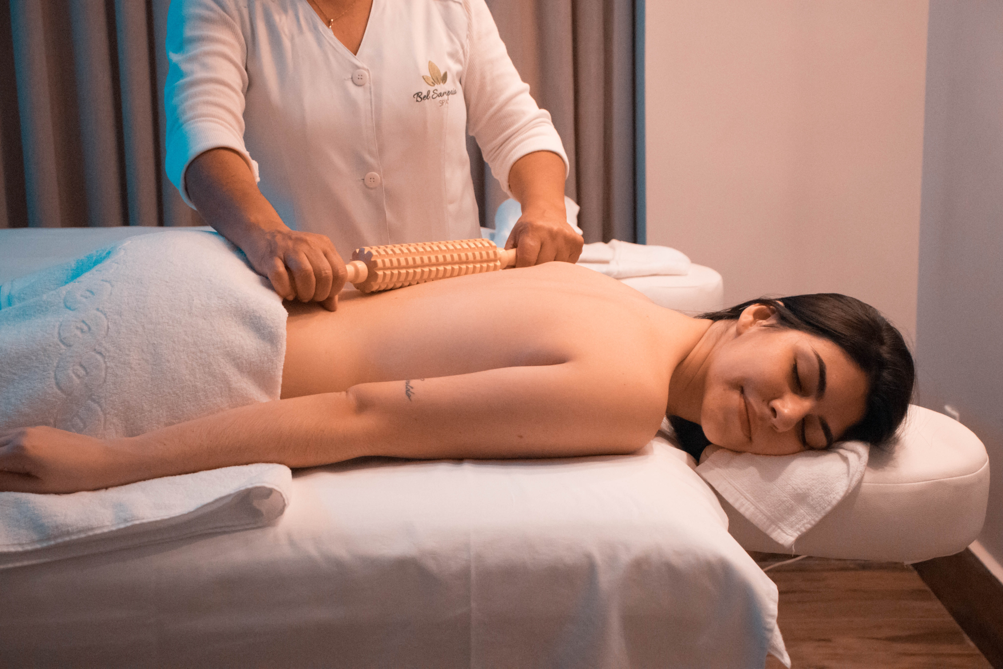 This image features a woman getting a massage, mimicking the effects of a spa capsule