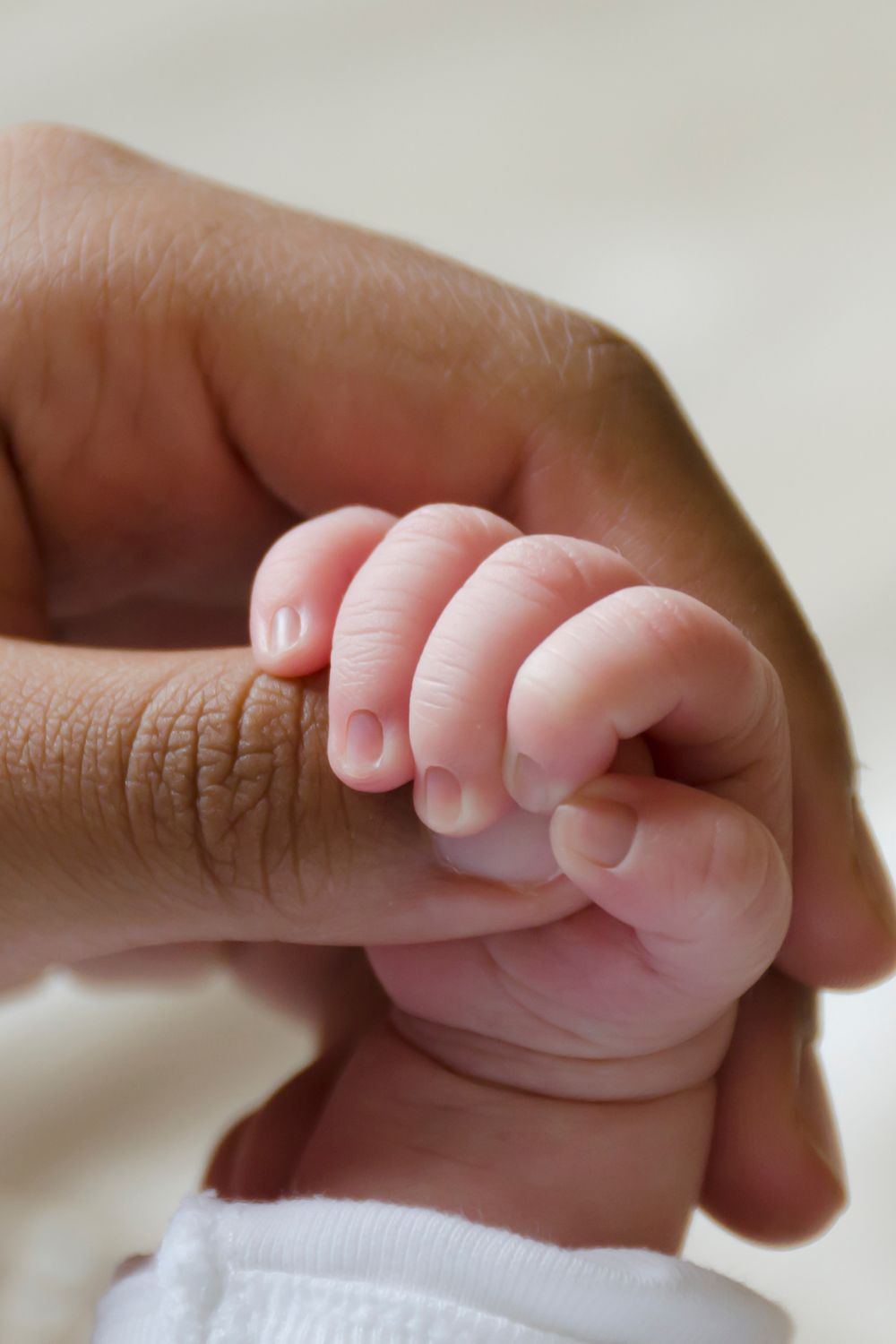 Close up image of a babies hand and nails