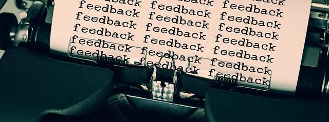 A typewriter with the word 'feedback' spelled out repeatedly, representing the idea of a reporting career.