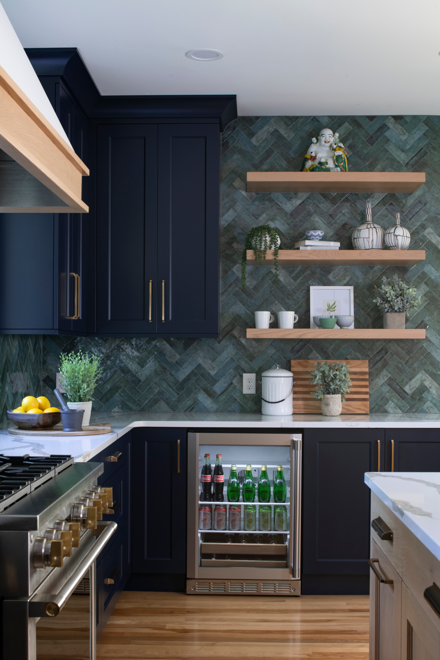 black kitchen cabinets with green tile
