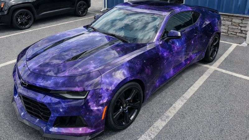 A car wrapped in galaxy-style vinyl wrap