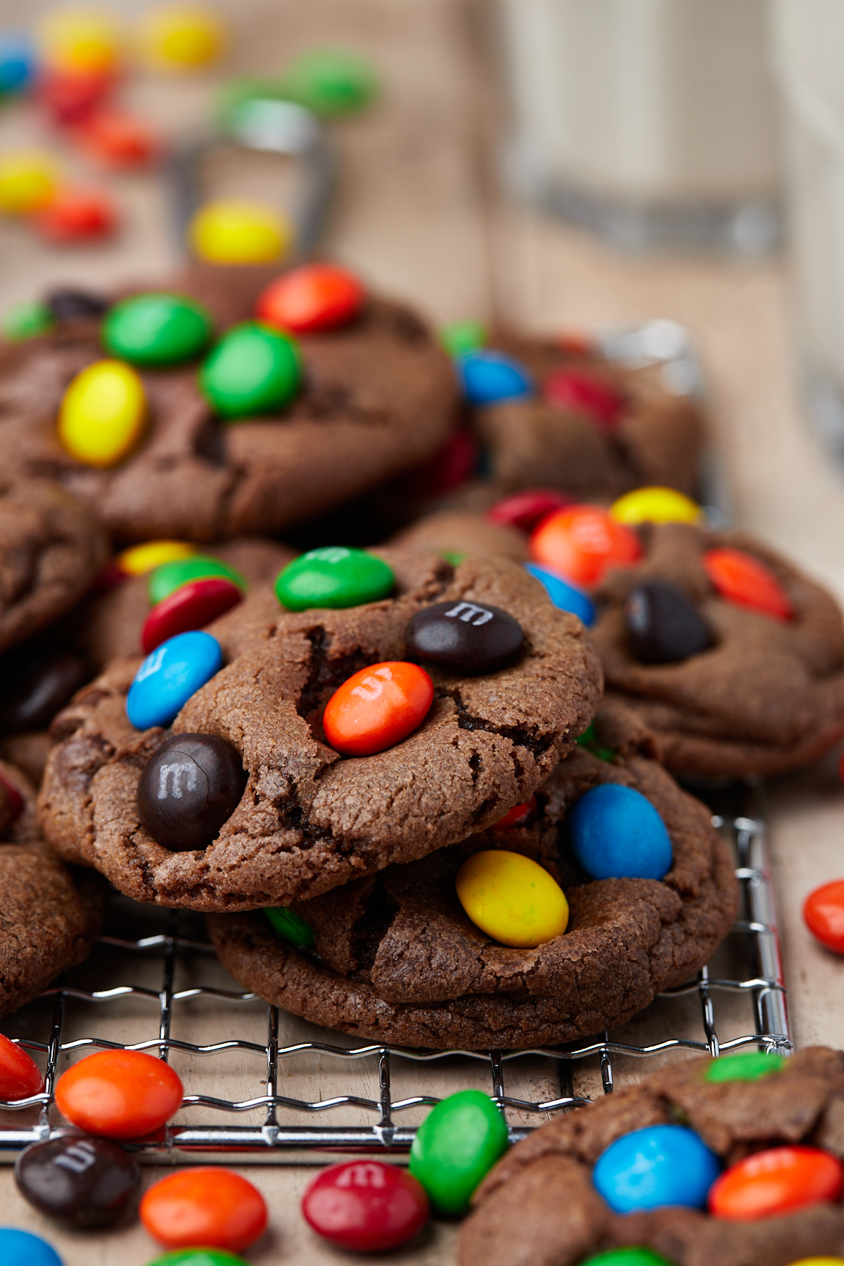 M&M chocolate cookies on a wire rack