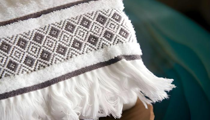 A microfiber towel with a emboridery design on edges