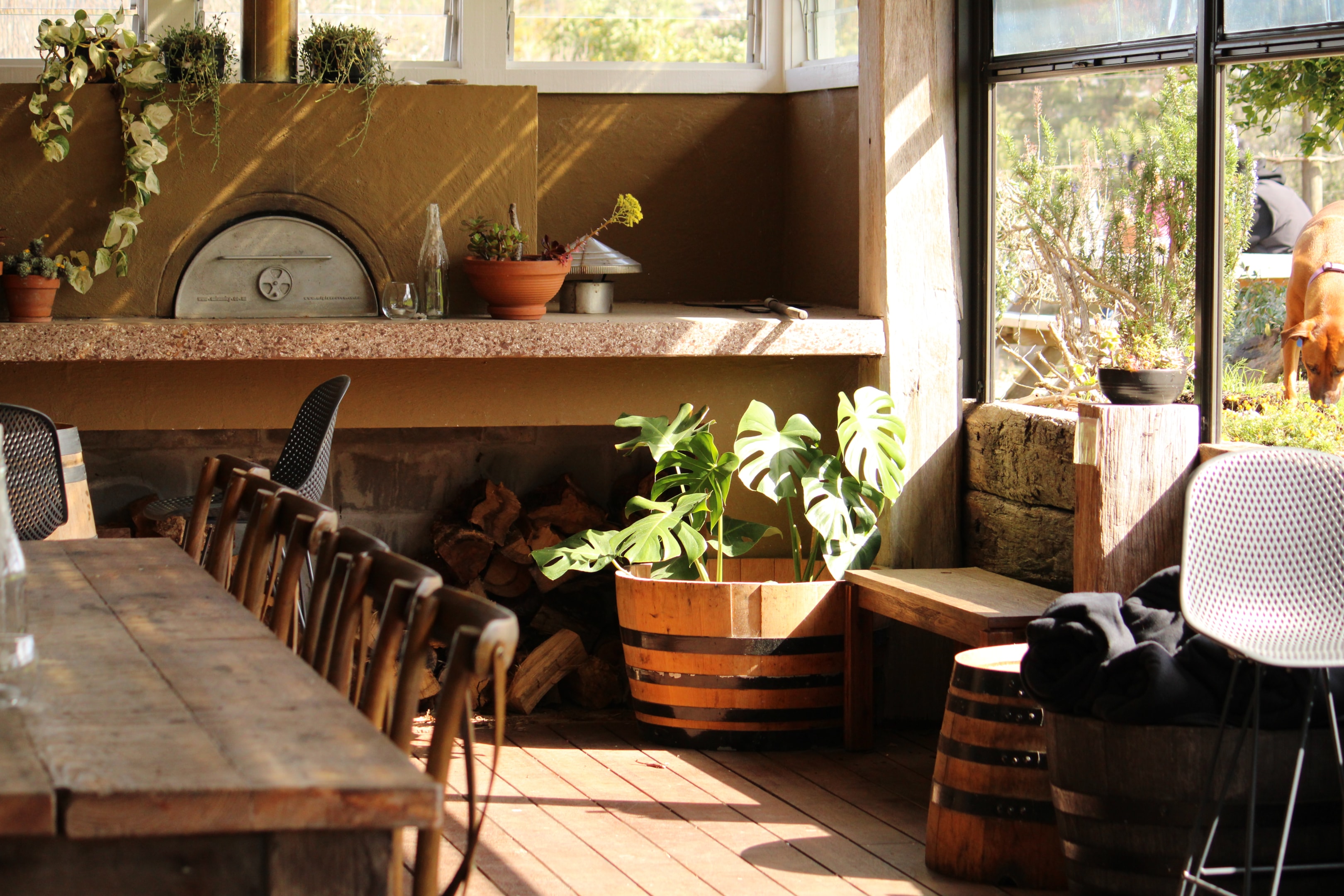 Inside Postage Stamp—bright, welcoming interior with vineyard views. Intimate vibe, right next to Tantalus.