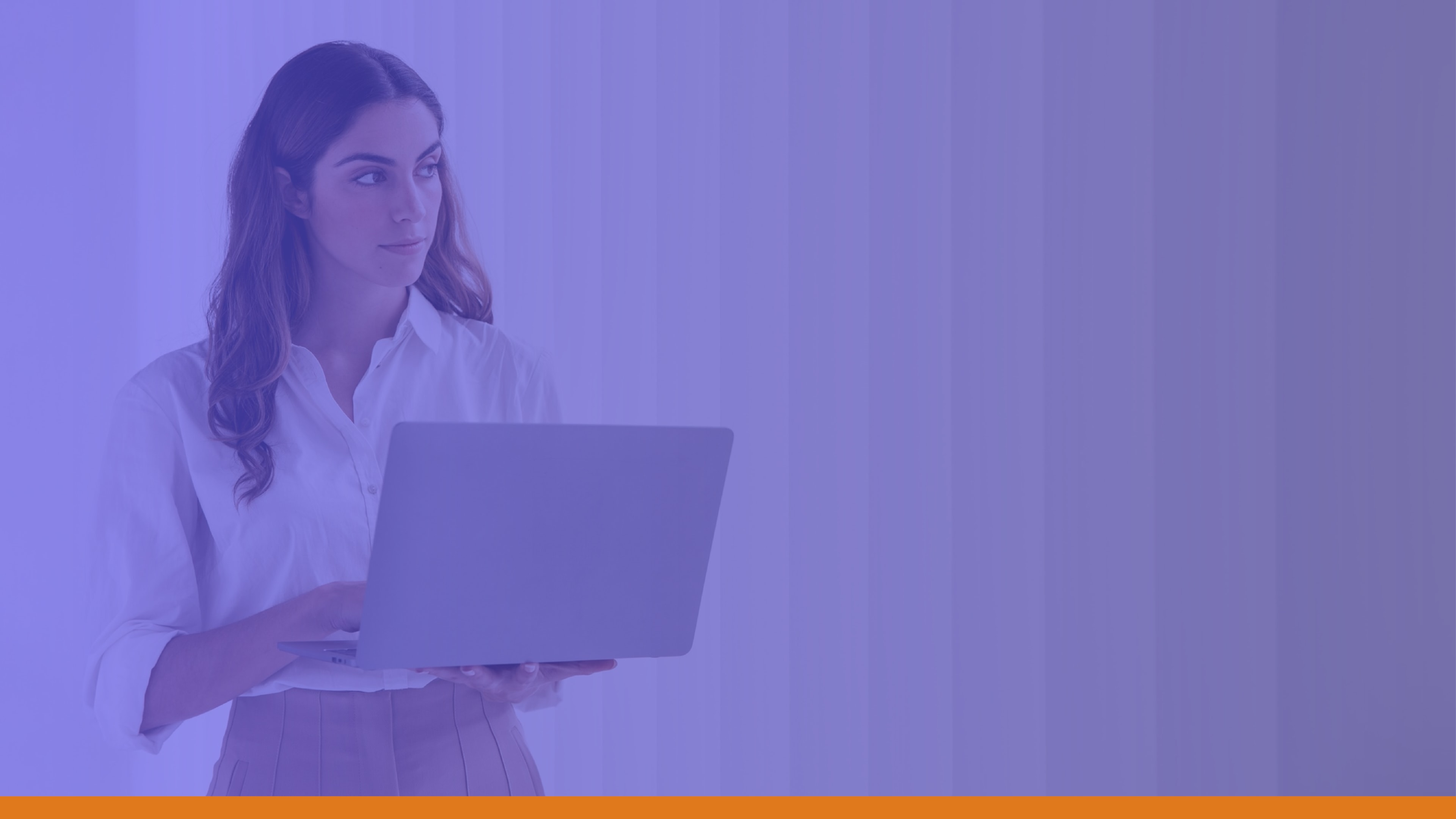 Professional woman holding a laptop and standing near window blinds, symbolizing a reliable emergency alert system that keeps local authorities and employees aligned with safety protocols.