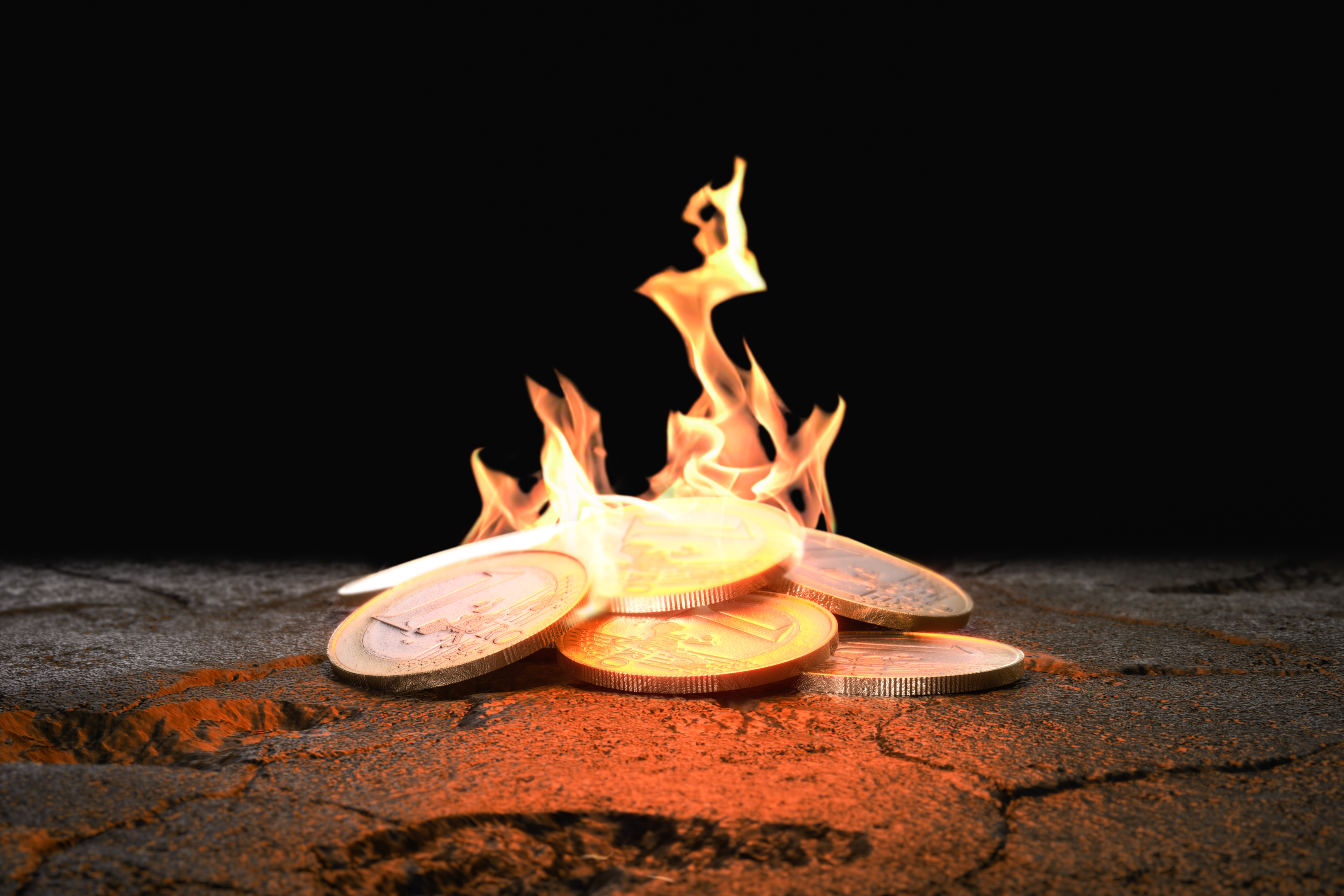 "Fiery coins on fractured terrain: a stark image of monetary damages impacting economies."