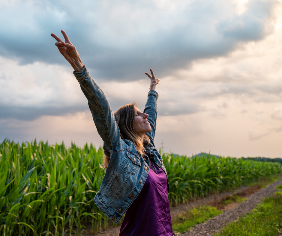 A person celebrating overcoming challenges on the path to sobriety with a fist pump