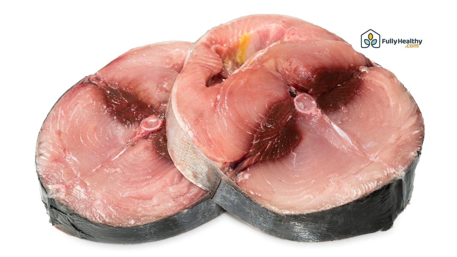 Two raw tuna steaks with skin on white background for cooking