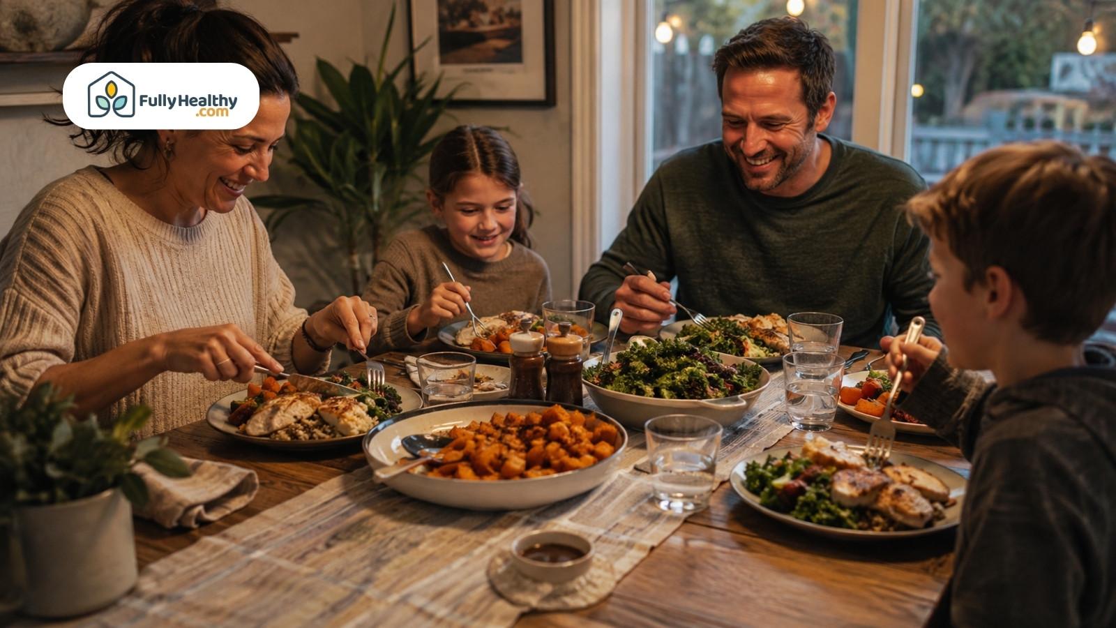 Family sharing roasted squash dinner with greens and lean protein at home