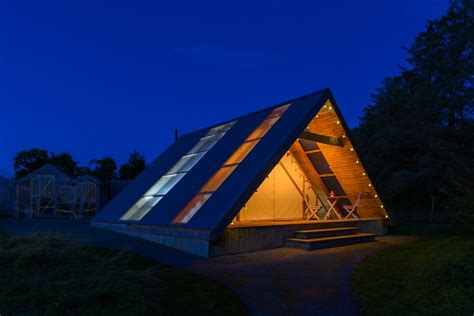 Night time image of a glamping pod in killarney