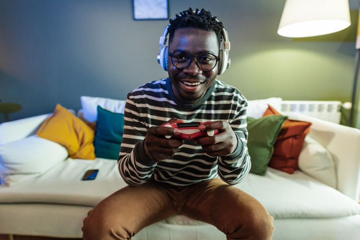 Young man playing video games. 