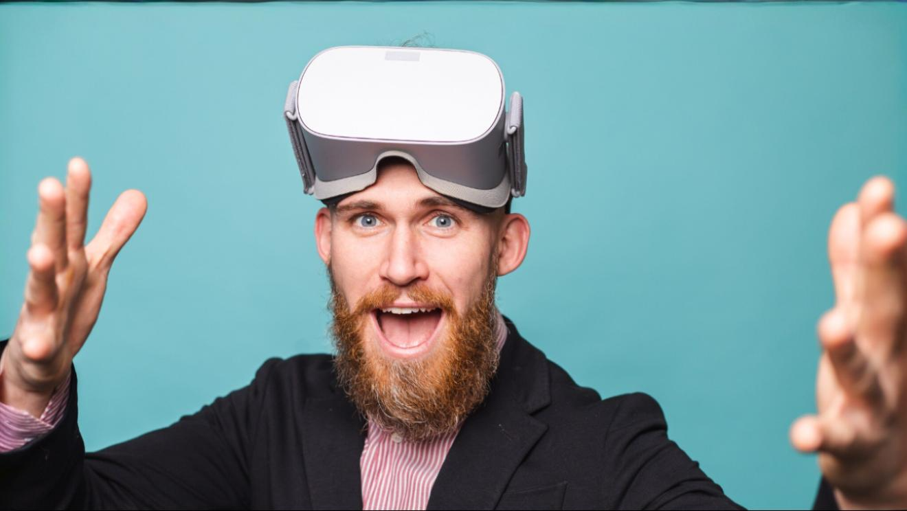 cyber security industry man with VR goggles raised. Conveys trying cybersecurity inbound marketing and getting real results.